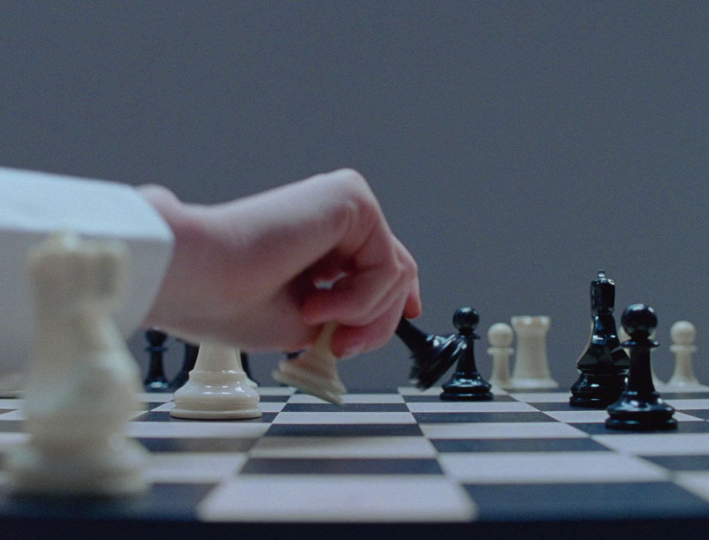 a person playing a game of chess on a chess board