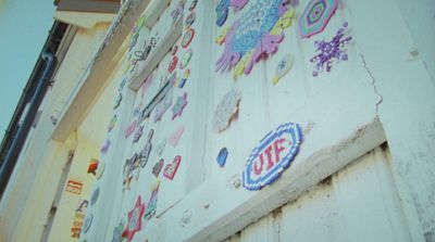 a wall with a lot of stickers on it