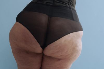 a woman's butt showing her butt and panties