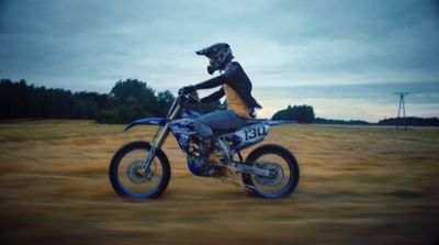 a person riding a dirt bike in a field