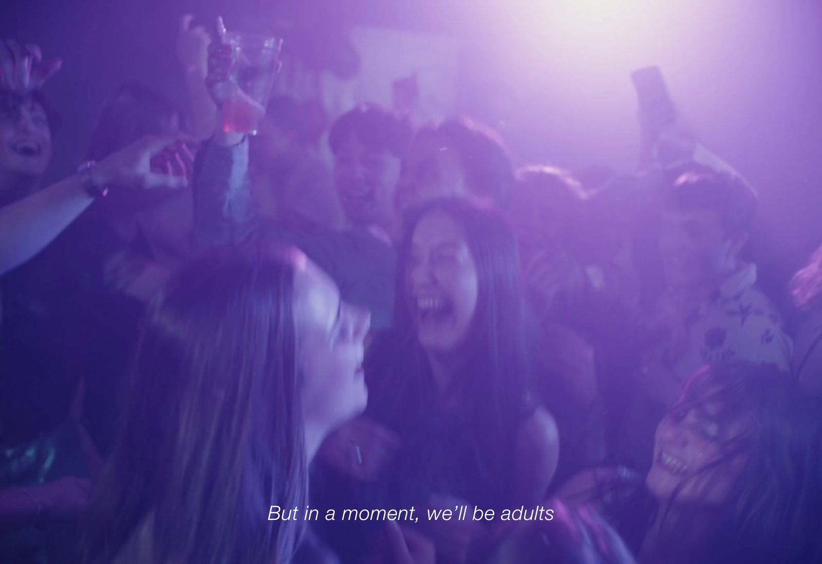a group of people standing around each other