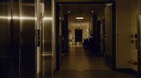 a long hallway leading to an office building
