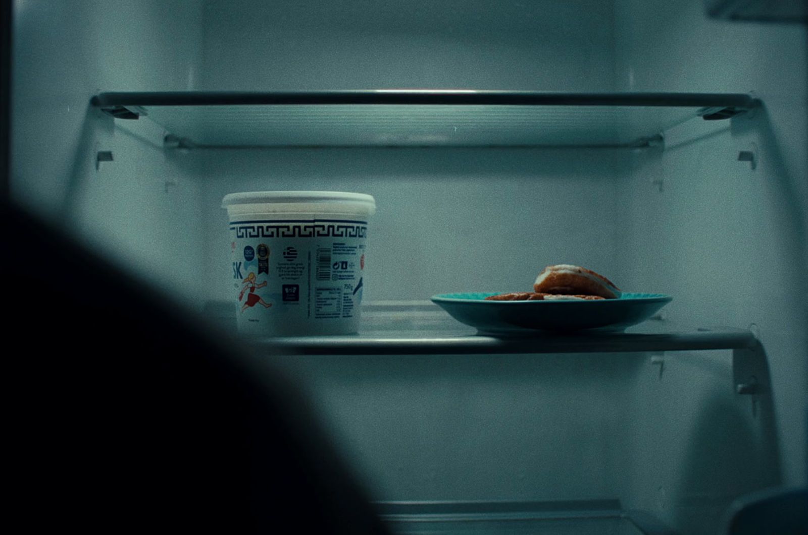 a bowl of food sitting on top of a shelf