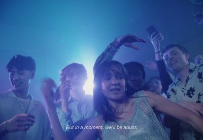 a group of people dancing at a party