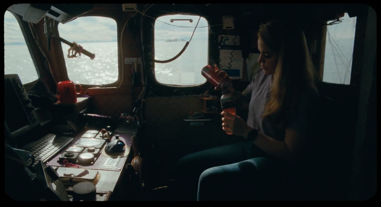 a woman sitting in a plane looking out the window