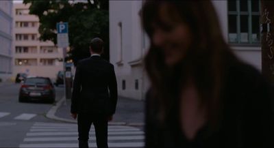 a man and a woman walking down a street