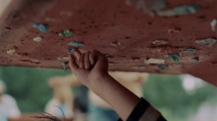 a close up of a person holding a board