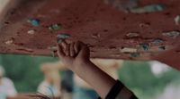 a close up of a person holding a board