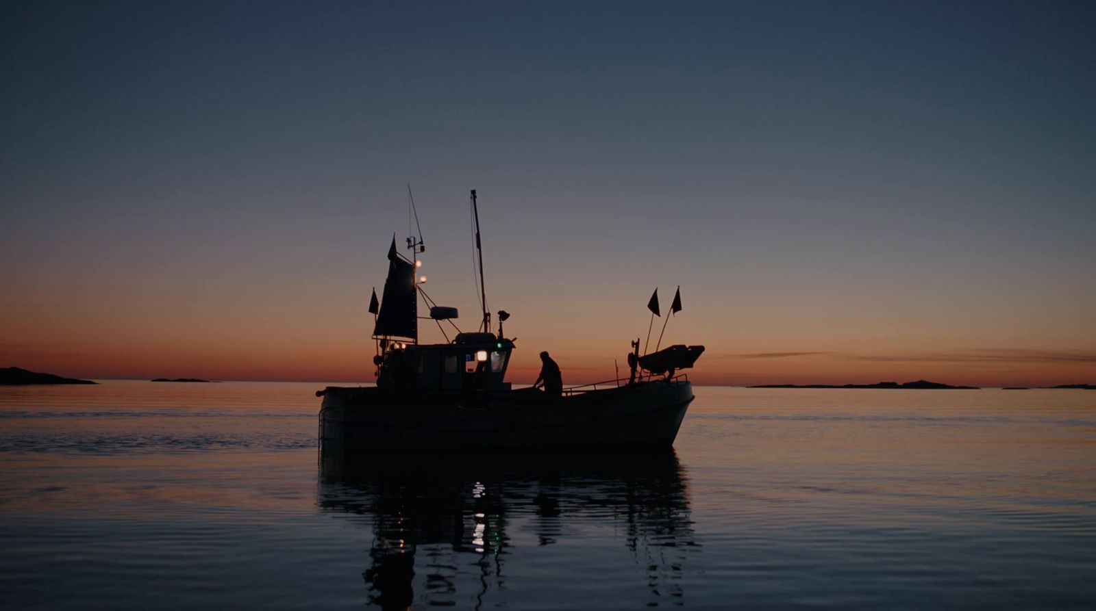 a boat floating on top of a body of water