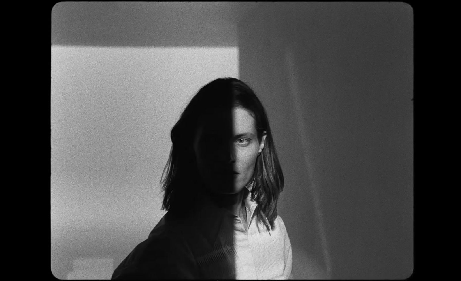 a black and white photo of a woman with long hair