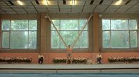 a group of people standing on top of a swimming pool