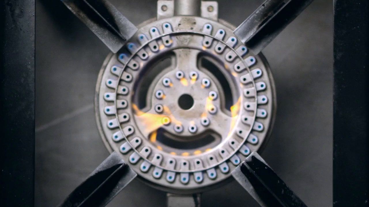 a close up of a metal object with a yellow light