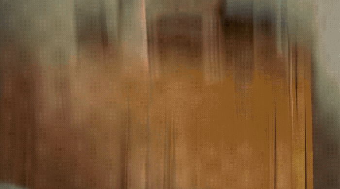 a blurry photo of a clock on a wall