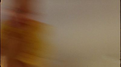 a blurry photo of a person holding a cell phone