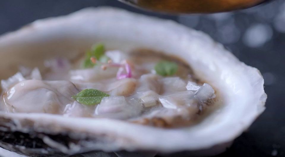 a close up of a bowl of food on a table