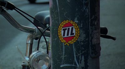 a close up of a bike with a sticker on it