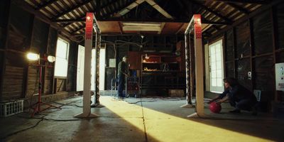 a person kneeling down in a large room