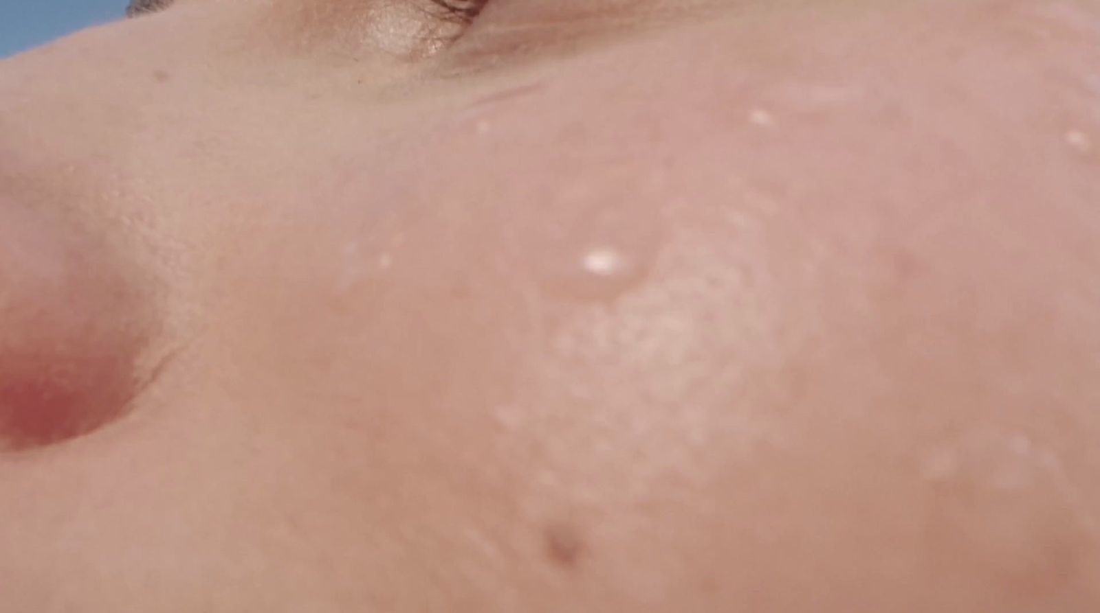 a close up of a person's nose with a lot of water on it