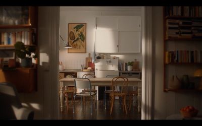 a kitchen with a table and chairs in it