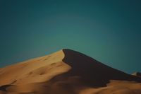 a large sand dune in the middle of a desert