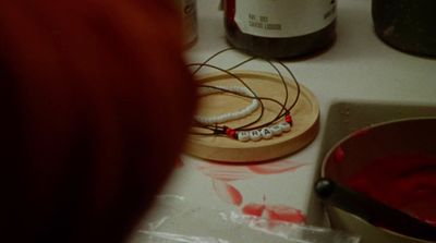 a close up of a person making something on a table