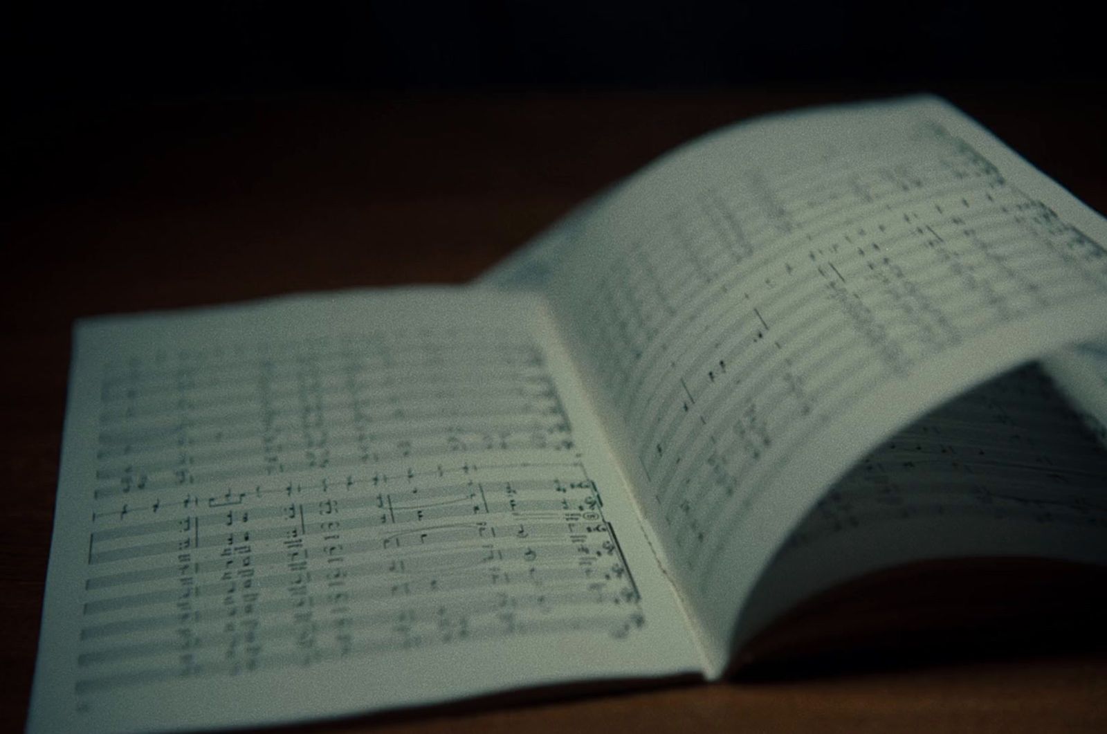 an open book with sheet music on it