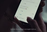 a person holding a cell phone in their hands