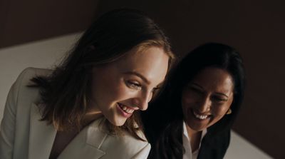 a couple of women standing next to each other