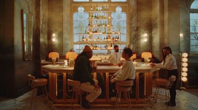 a group of people sitting at a bar