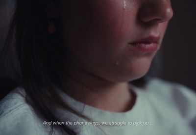 a close up of a person with a sad look on their face