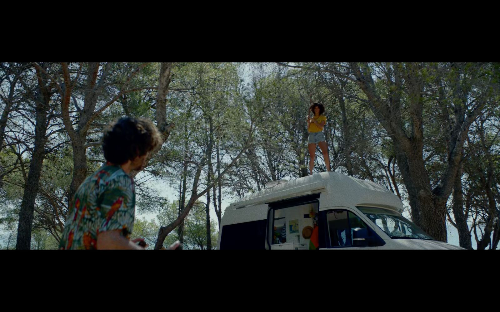 a woman standing on top of a food truck