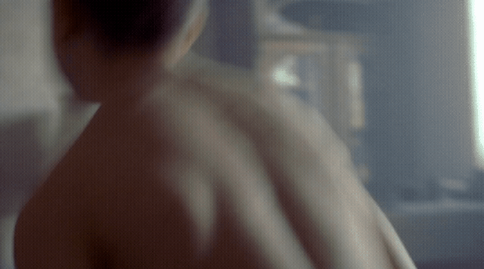 a blurry image of a man with no shirt on
