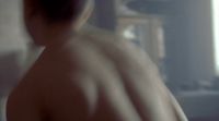 a blurry image of a man with no shirt on