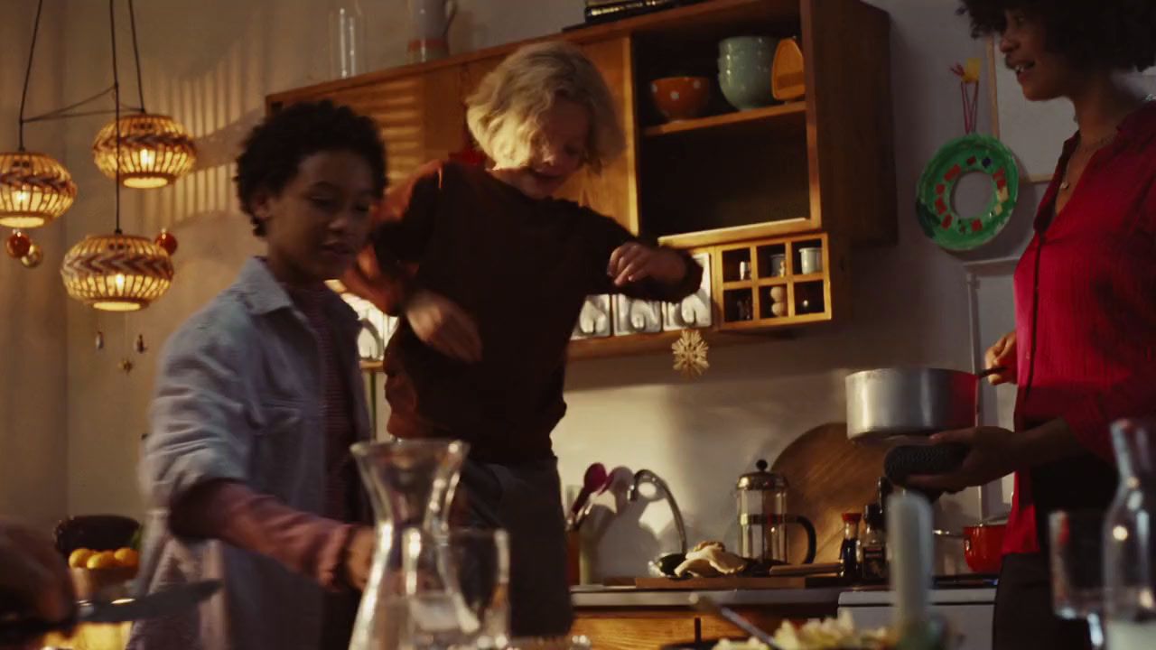 a group of people in a kitchen preparing food