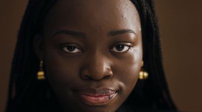 a close up of a person wearing earrings