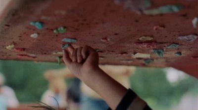 a close up of a person holding a board above their head