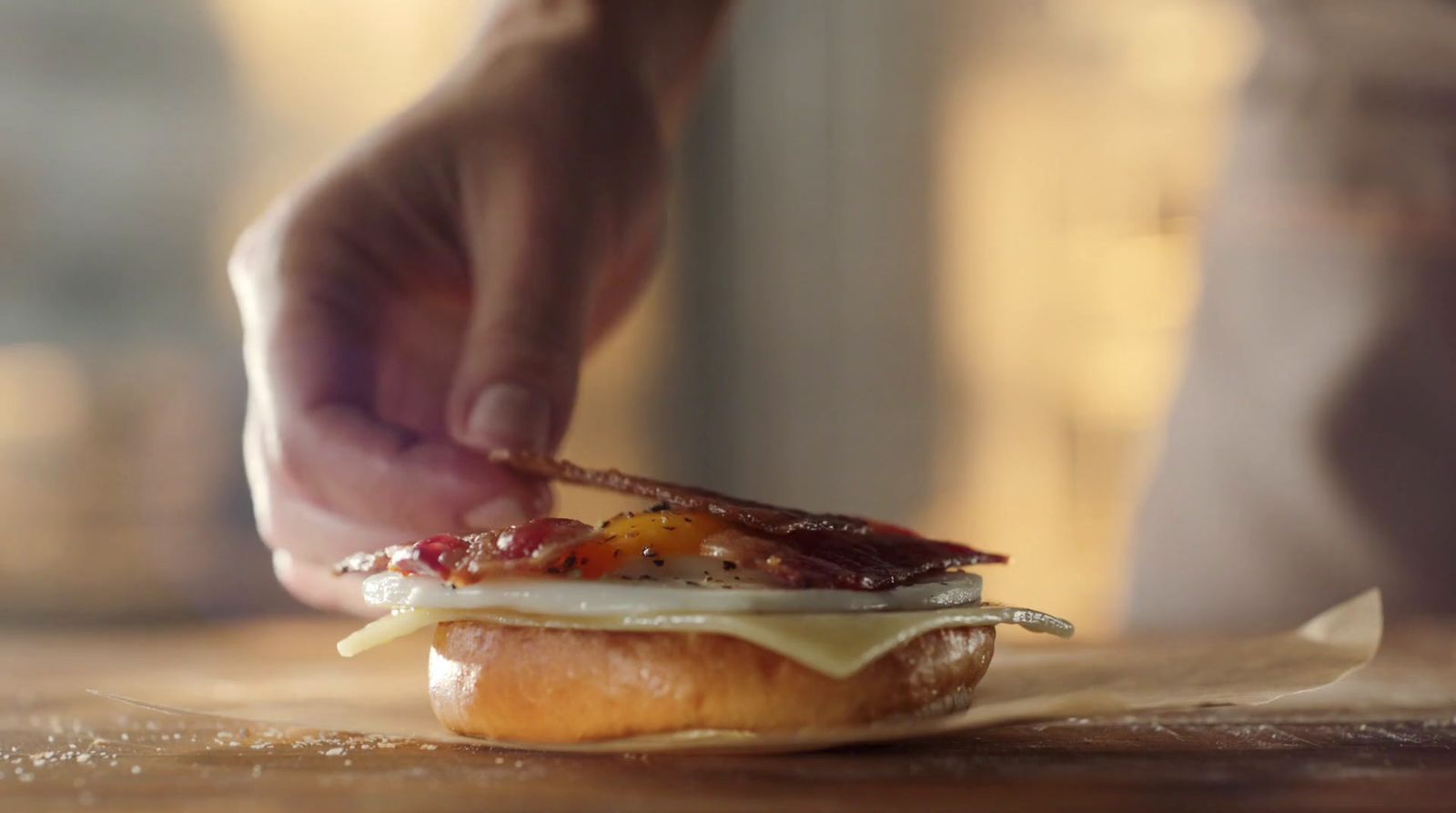 a close up of a person making a sandwich