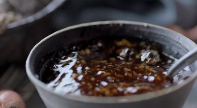 a close up of a bowl of food on a table