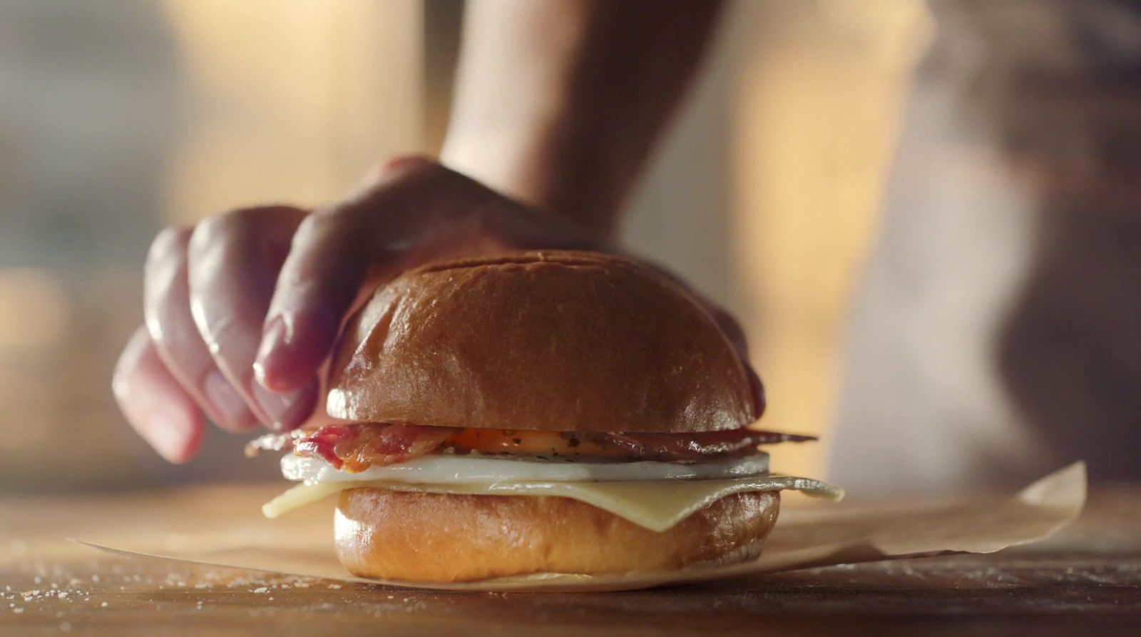 a close up of a person holding a sandwich