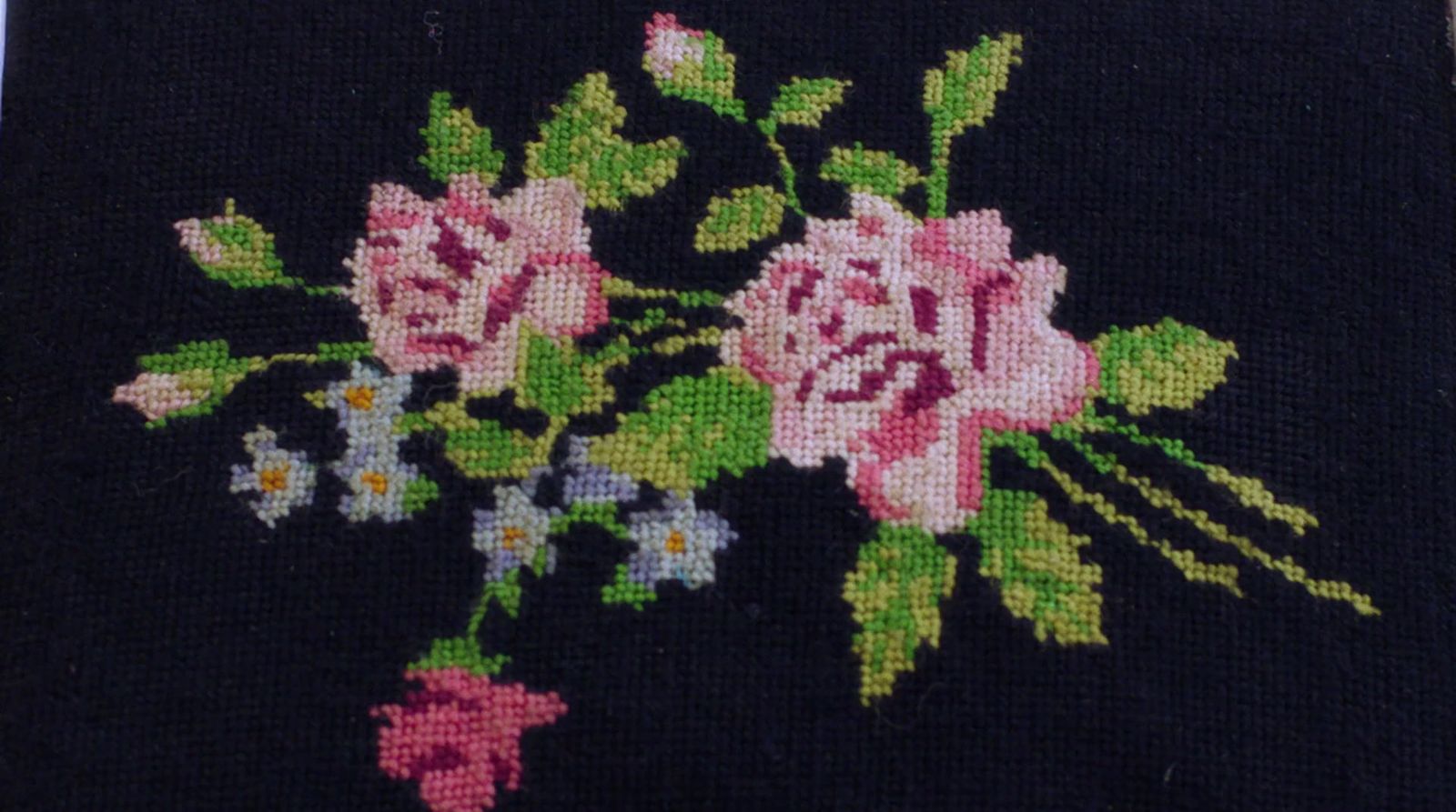 a close up of a piece of cloth with flowers on it