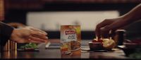 a couple of people sitting at a table with food