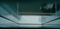 a person standing on a ledge in a room