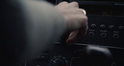 a person is pressing buttons on a radio