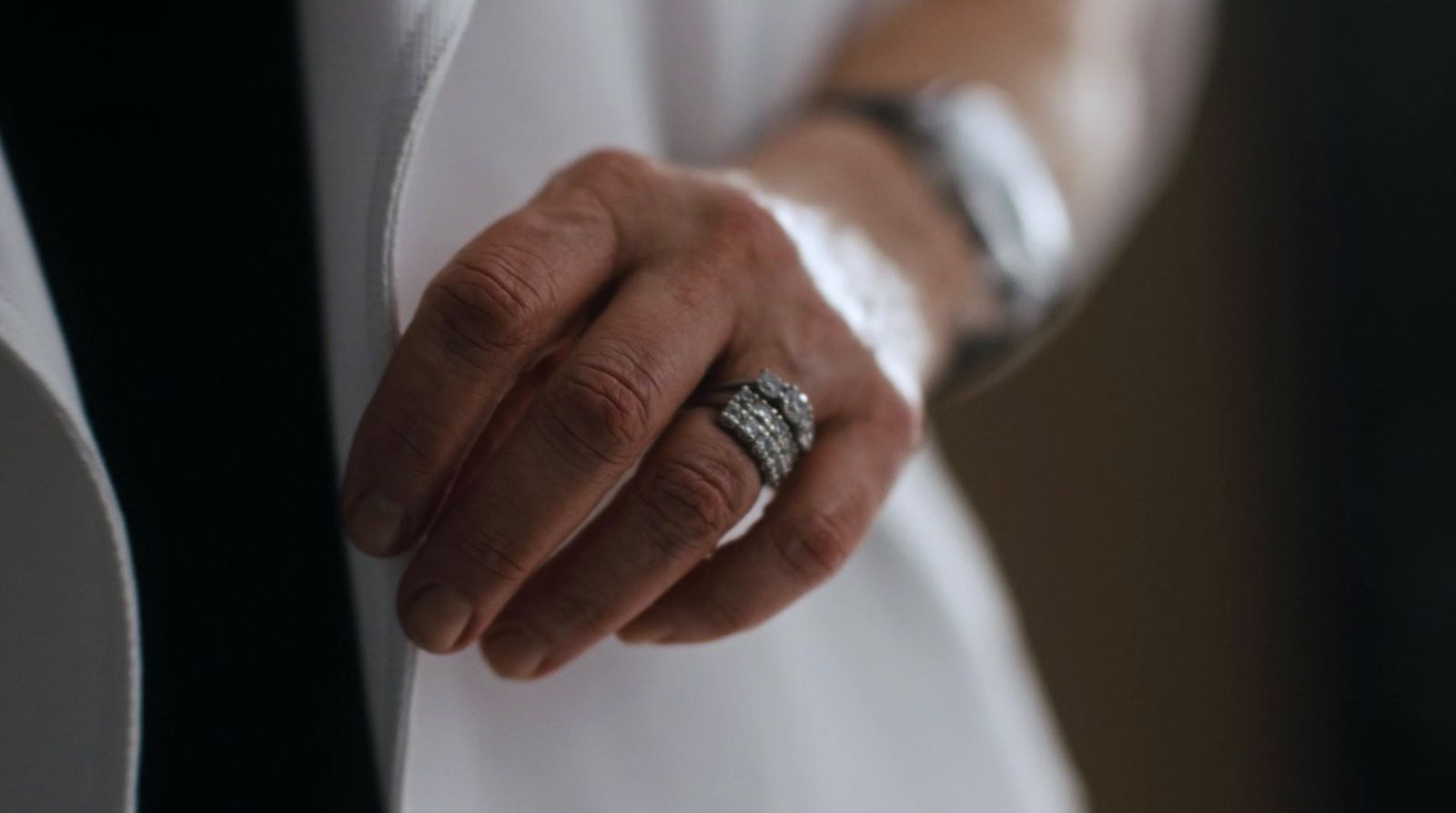 a person wearing a ring on their left hand