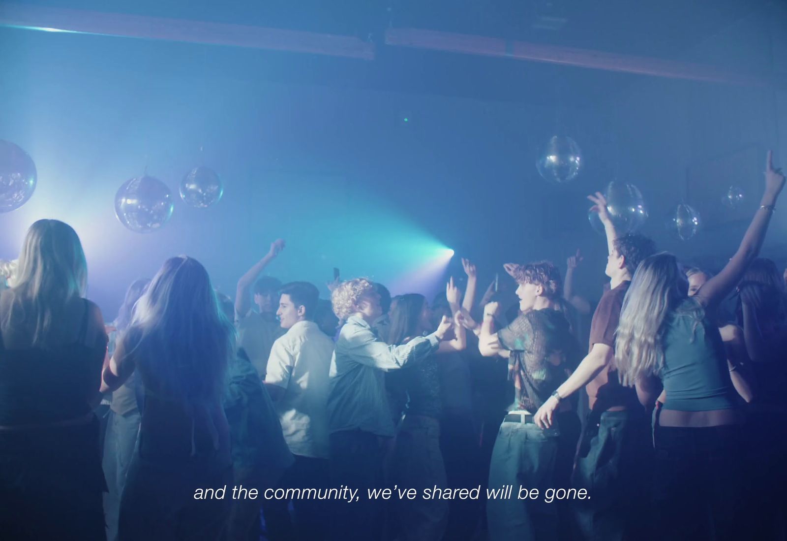 a group of people dancing in a club