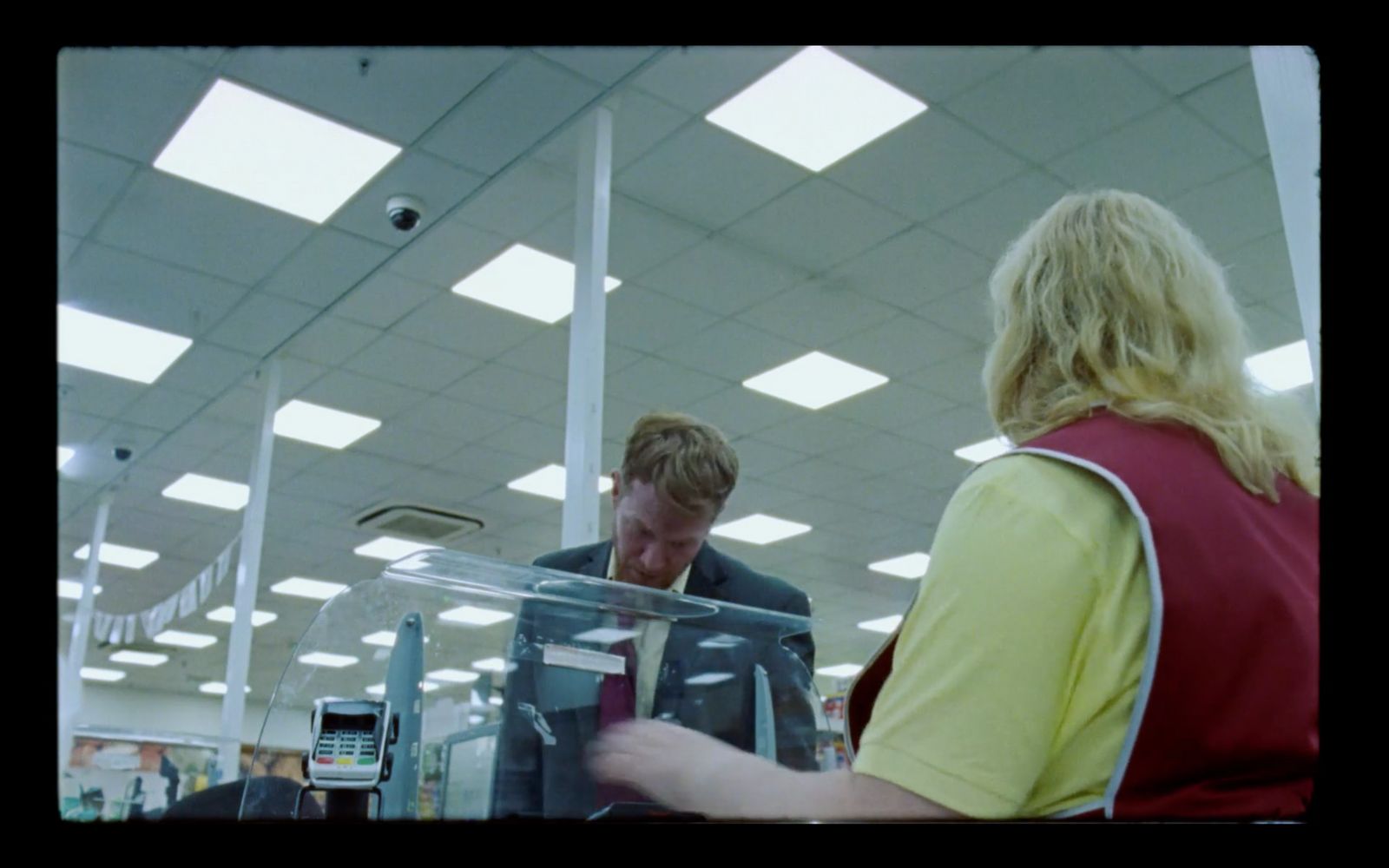 a couple of people that are standing in a store