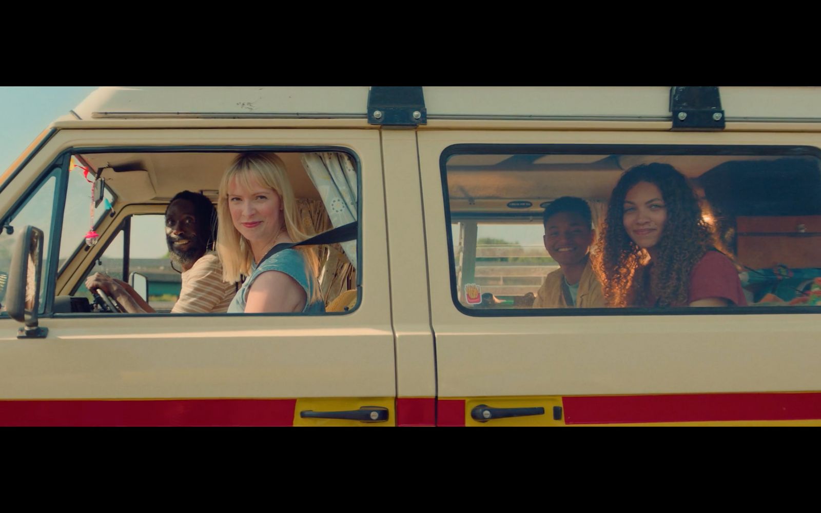 a group of women riding in the back of a van