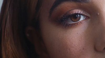 a close up of a woman's eye with long lashes