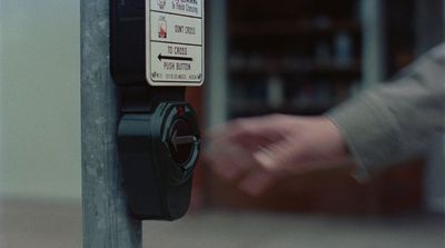 a parking meter with a hand on it