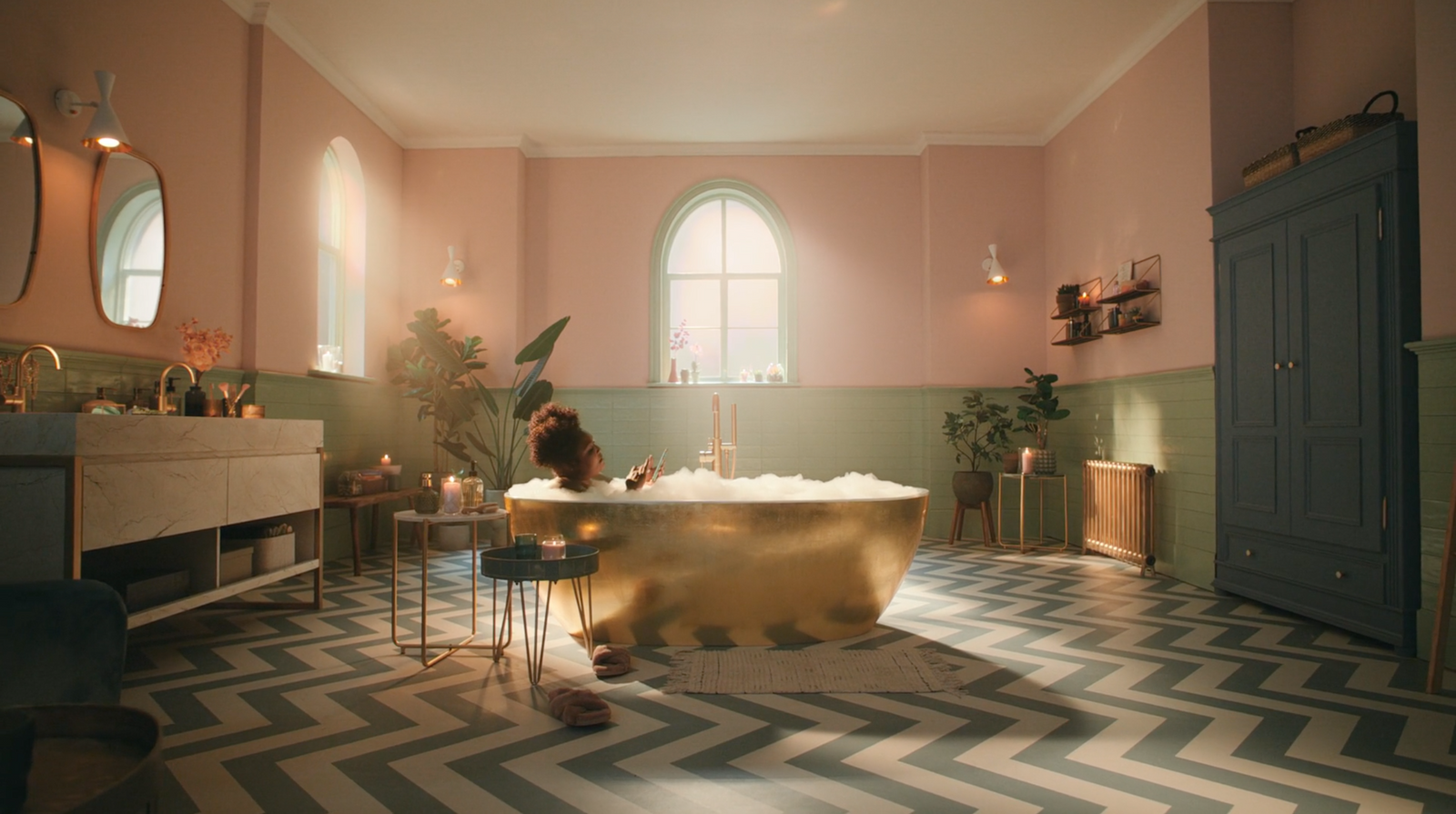 a bath room with a bath tub a table and a mirror